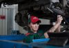 woman holding gray steel wrench