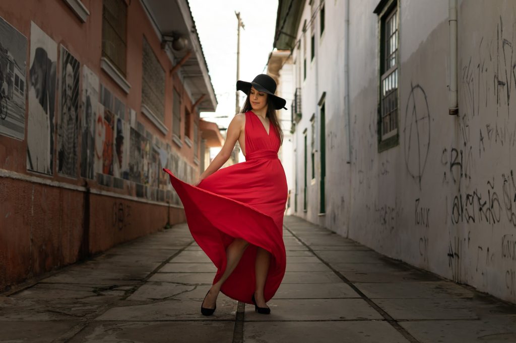 woman in red v neck sleeveless dress