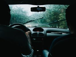 two men inside moving vehicle
