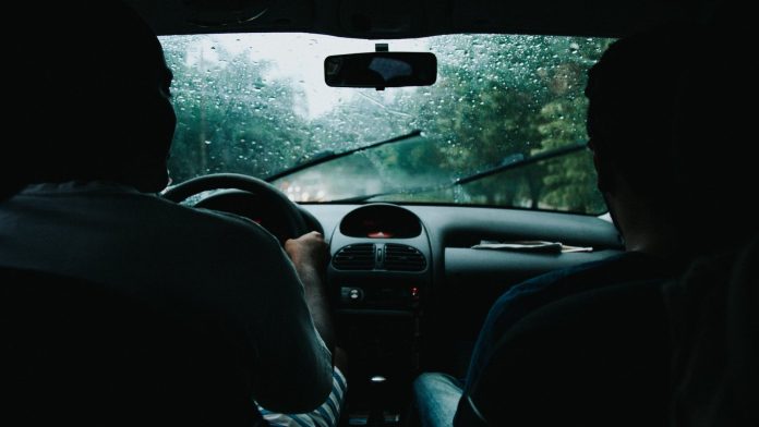 pexels-photo-799463 two men inside moving vehicle